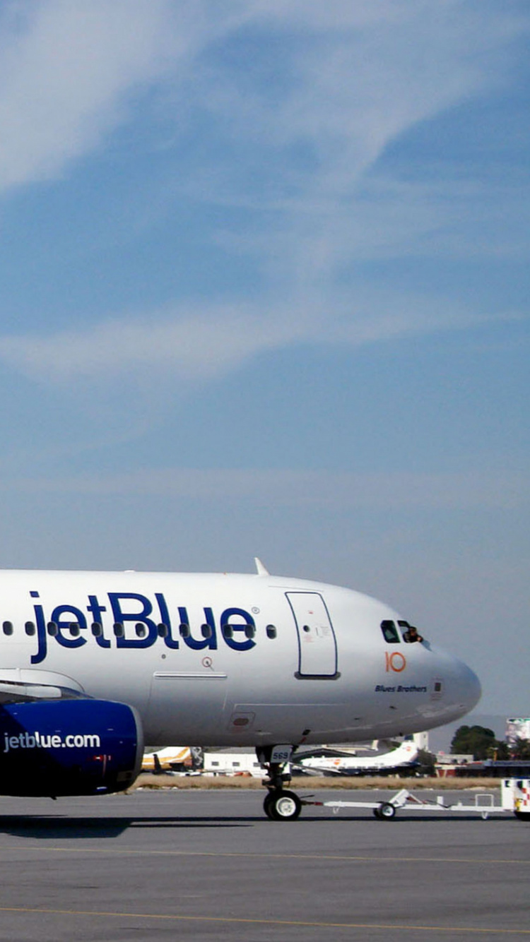 White and Blue Passenger Plane on Airport During Daytime. Wallpaper in 750x1334 Resolution