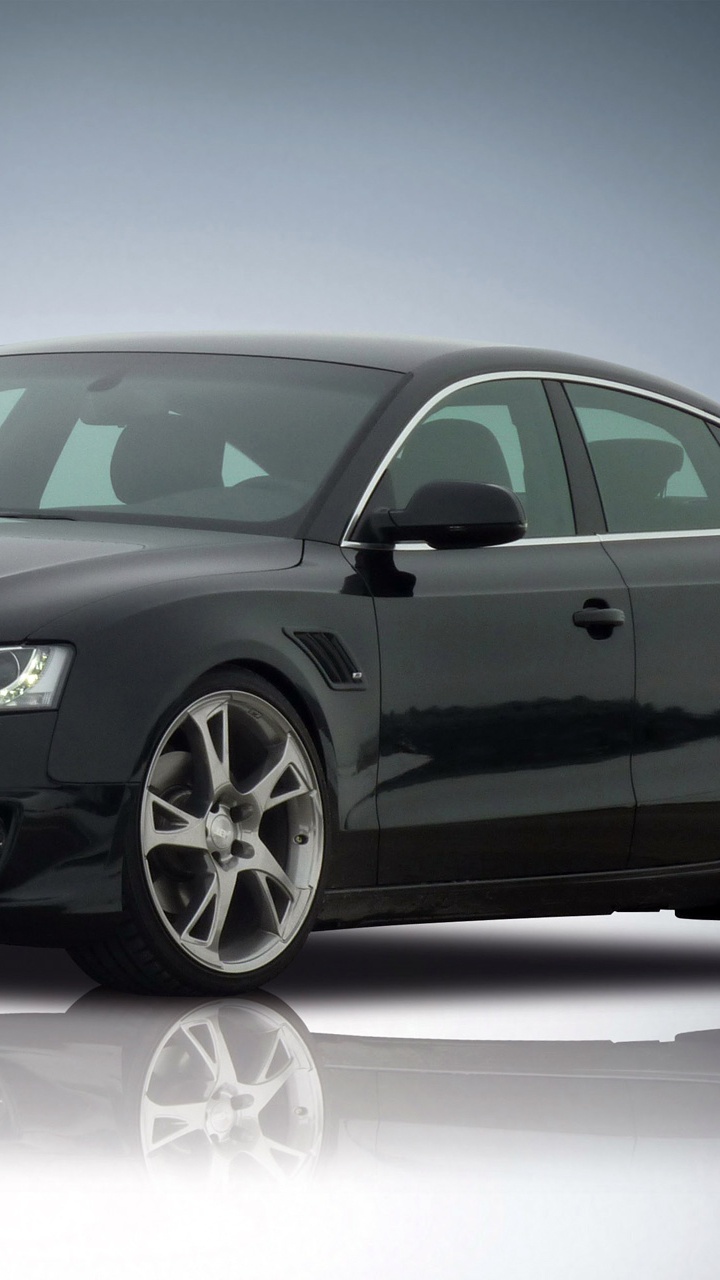 Mercedes Benz Coupe Negro Sobre Superficie Blanca. Wallpaper in 720x1280 Resolution