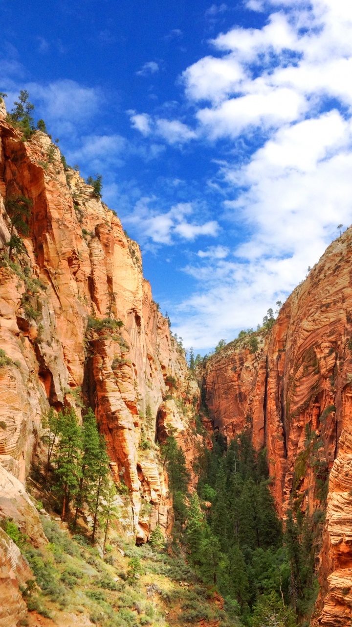 Brown Rocky Mountain Under Blue Sky During Daytime. Wallpaper in 720x1280 Resolution