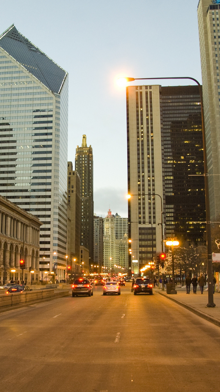 Cars Parked on Side of The Road Near High Rise Buildings During Night Time. Wallpaper in 750x1334 Resolution