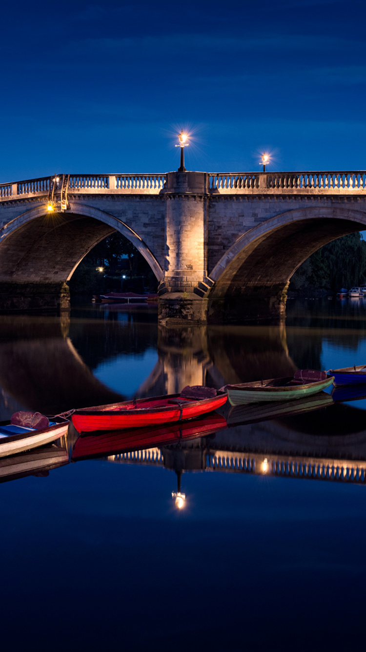 Brown and Red Boat on River Under Bridge During Night Time. Wallpaper in 750x1334 Resolution