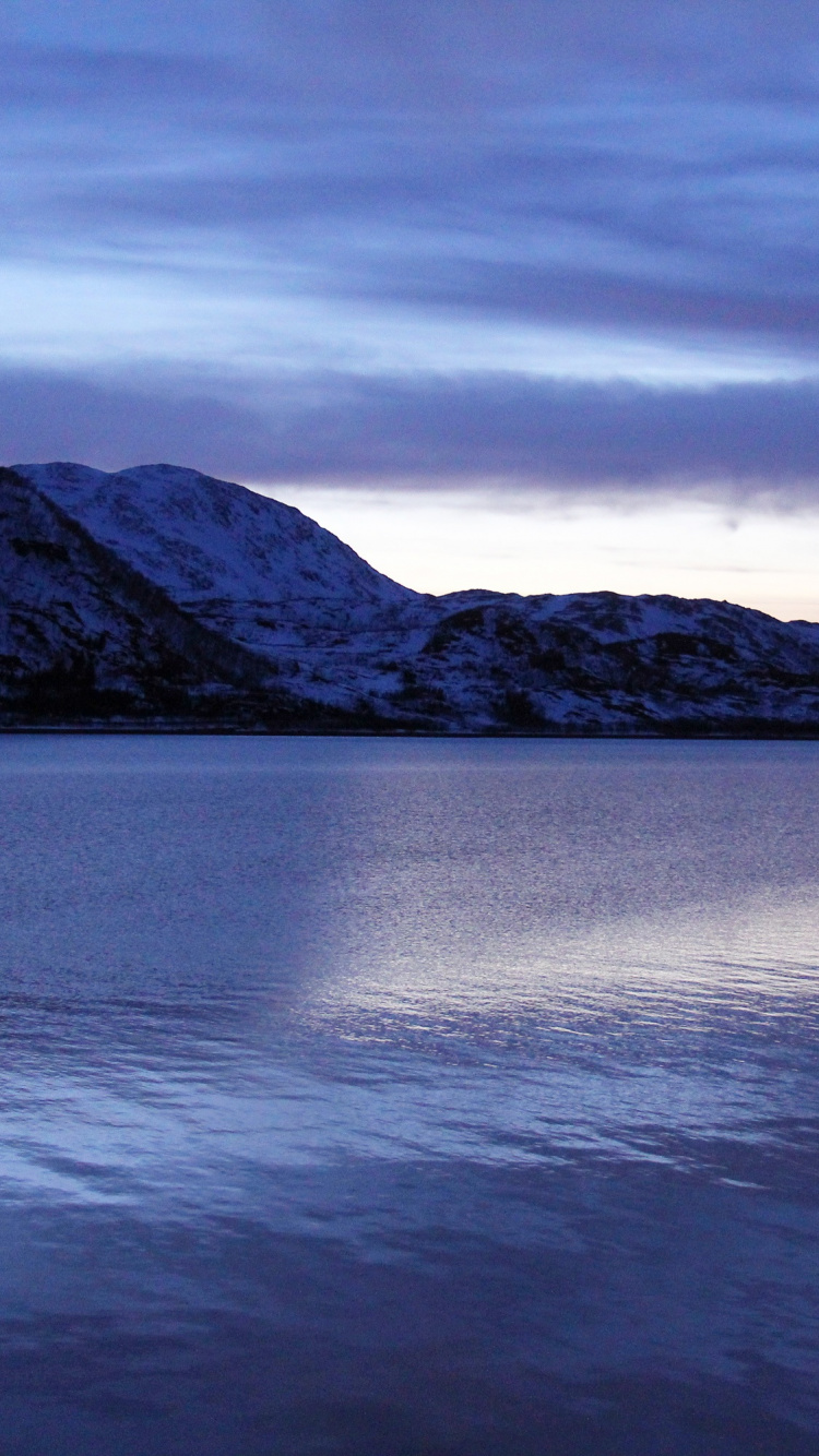 Body of Water Near Mountain Under Cloudy Sky During Daytime. Wallpaper in 750x1334 Resolution