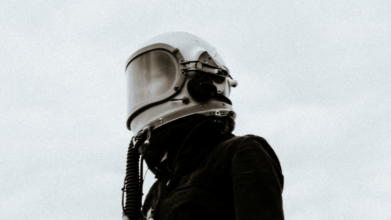 Grayscale Photo of Man in Black Jacket and Helmet. Wallpaper in 1280x720 Resolution