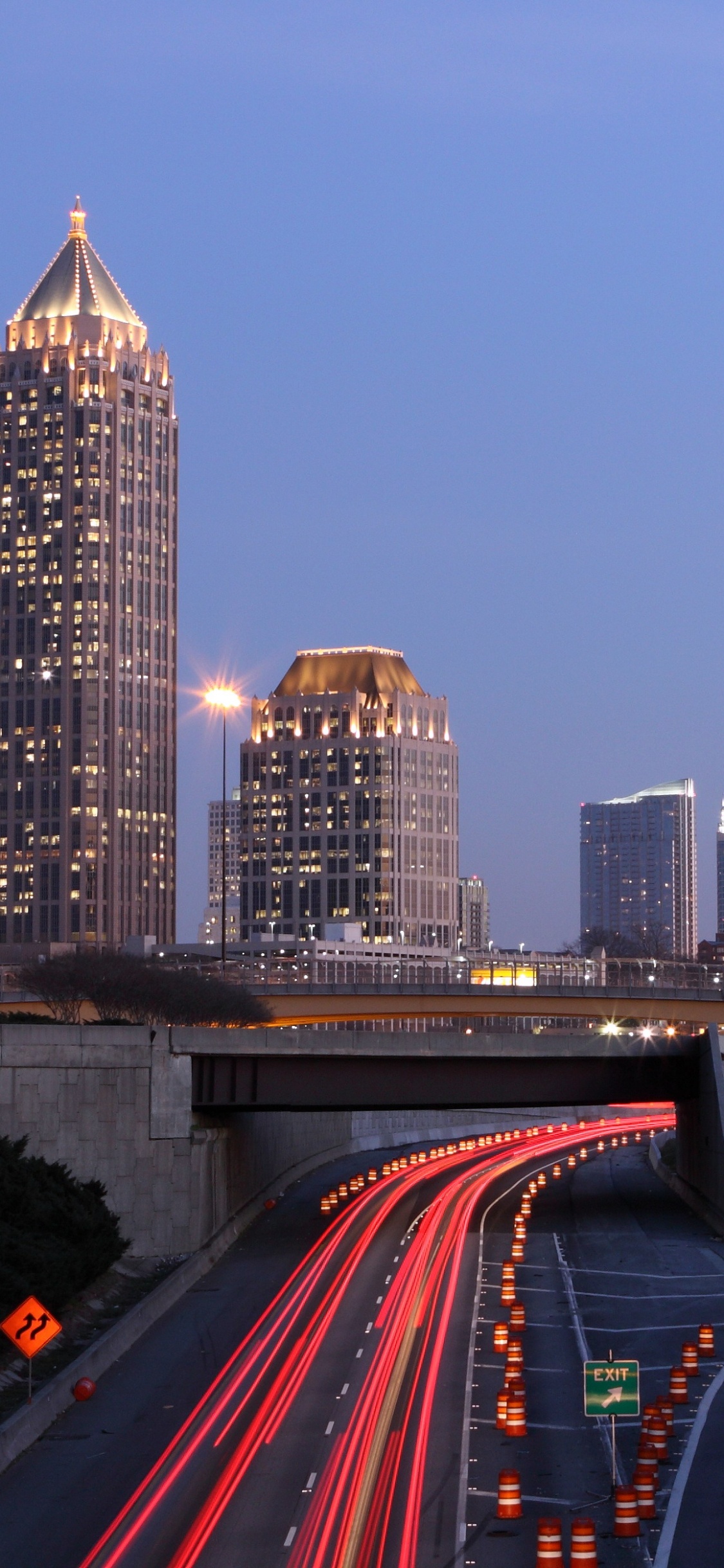 Time Lapse Photography of City Skyline During Night Time. Wallpaper in 1125x2436 Resolution