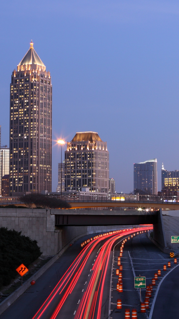 Time Lapse Photography of City Skyline During Night Time. Wallpaper in 750x1334 Resolution