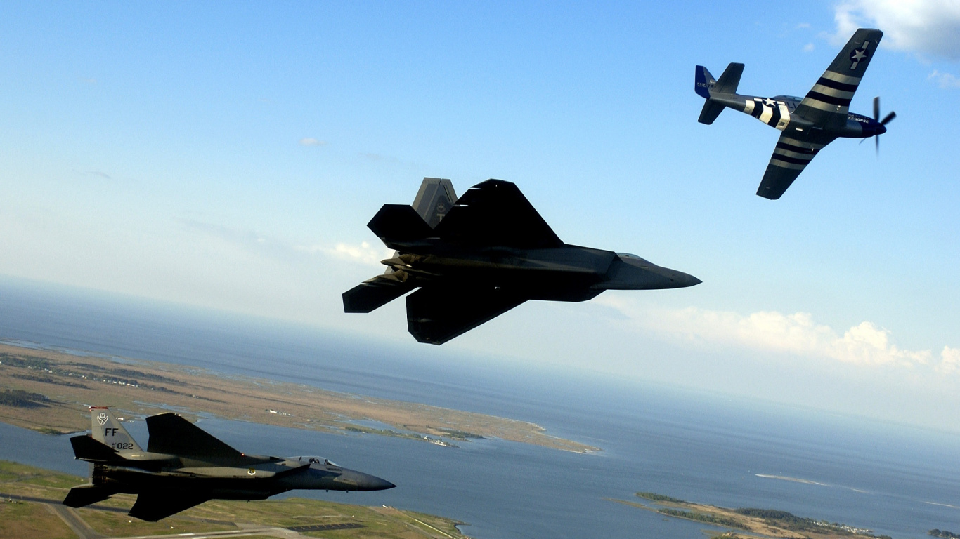 Black Jet Plane Flying Over City During Daytime. Wallpaper in 1366x768 Resolution