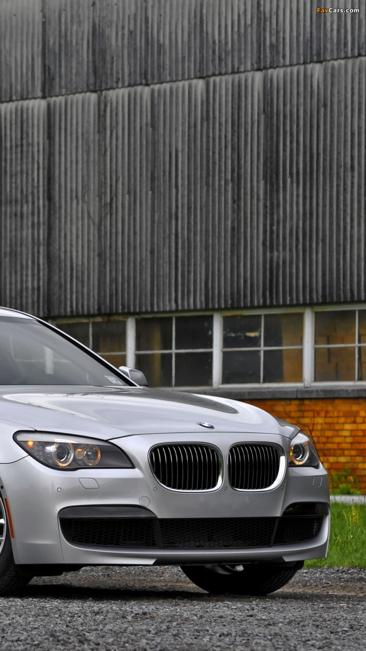 Silver Mercedes Benz Sedan Parked Beside Brown Wooden Wall. Wallpaper in 750x1334 Resolution