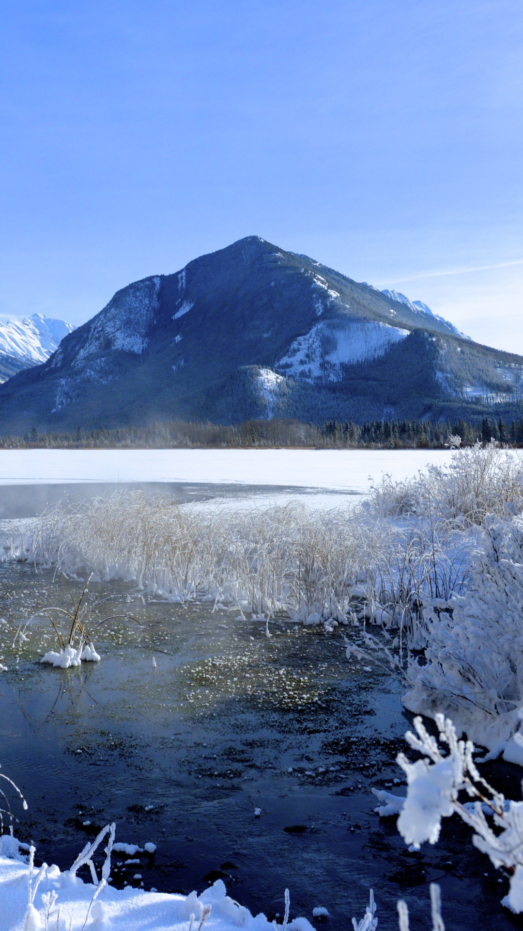 Snow Covered Mountain Near Lake Under Blue Sky During Daytime. Wallpaper in 1080x1920 Resolution