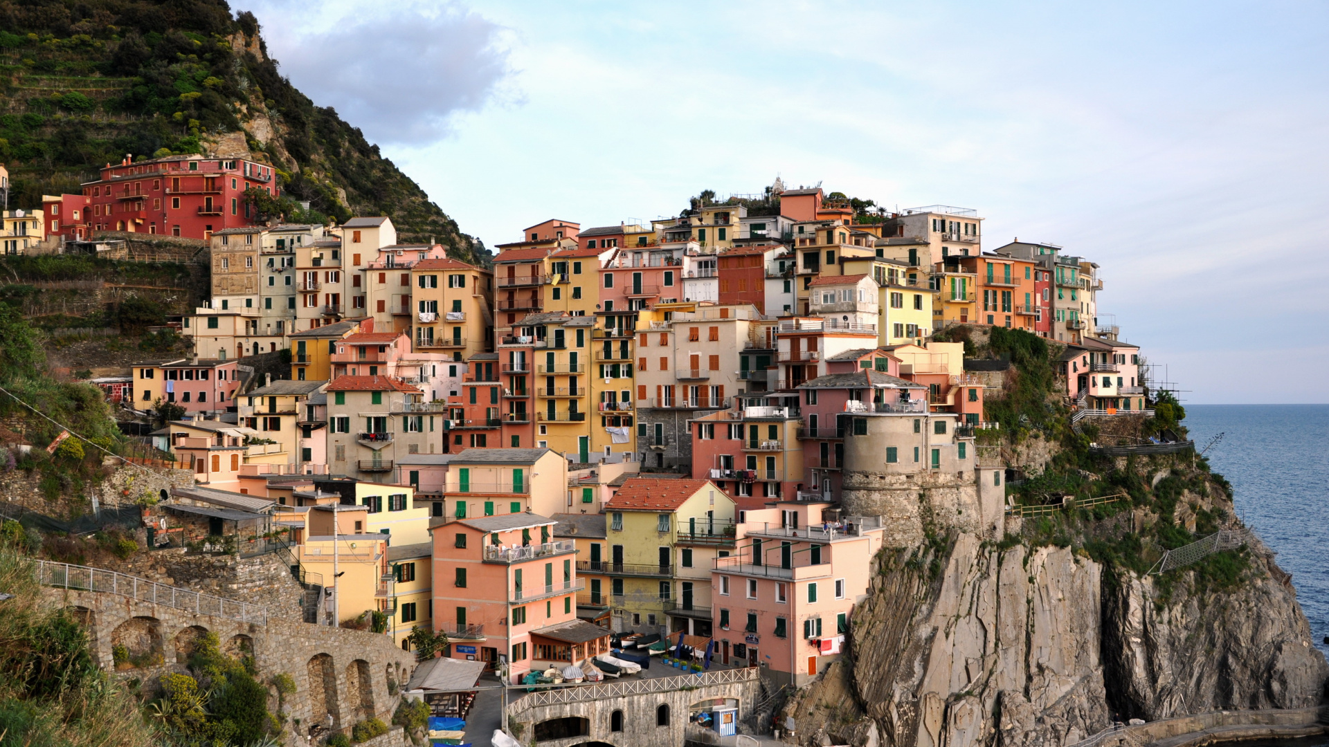 Brown and White Concrete Houses on Mountain During Daytime. Wallpaper in 1920x1080 Resolution