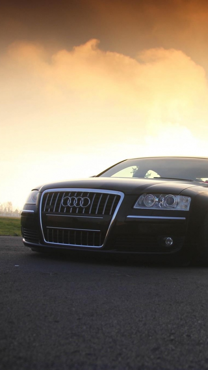 Schwarzer Bmw m 3 Unterwegs Bei Sonnenuntergang. Wallpaper in 720x1280 Resolution