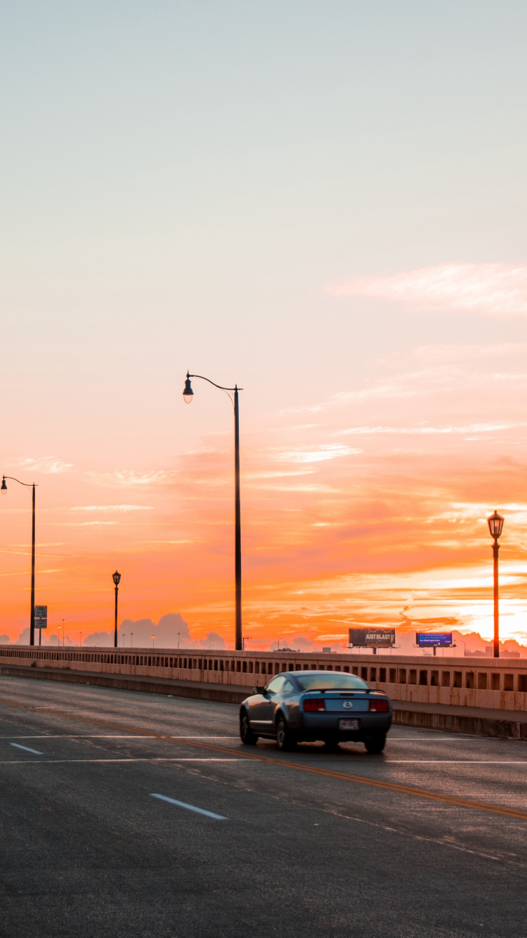Black Car on Road During Sunset. Wallpaper in 750x1334 Resolution