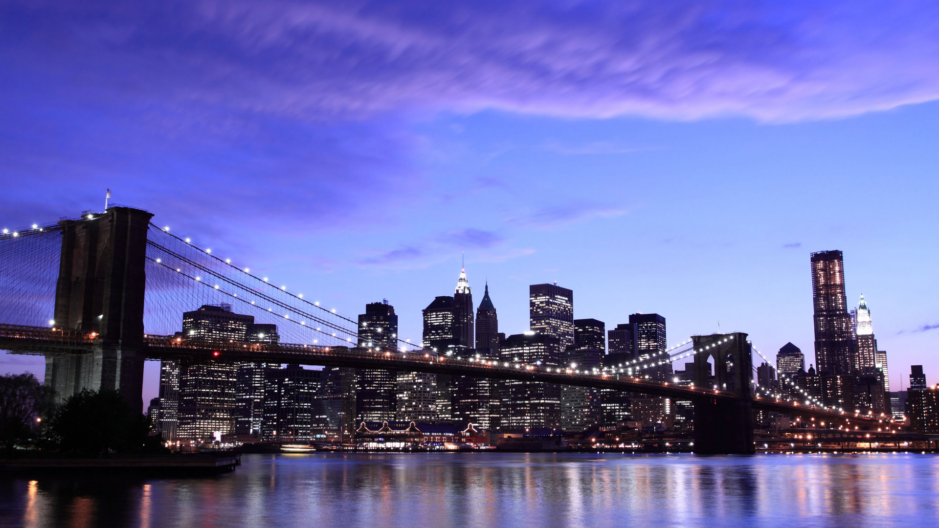 City Skyline Across Body of Water During Night Time. Wallpaper in 1920x1080 Resolution