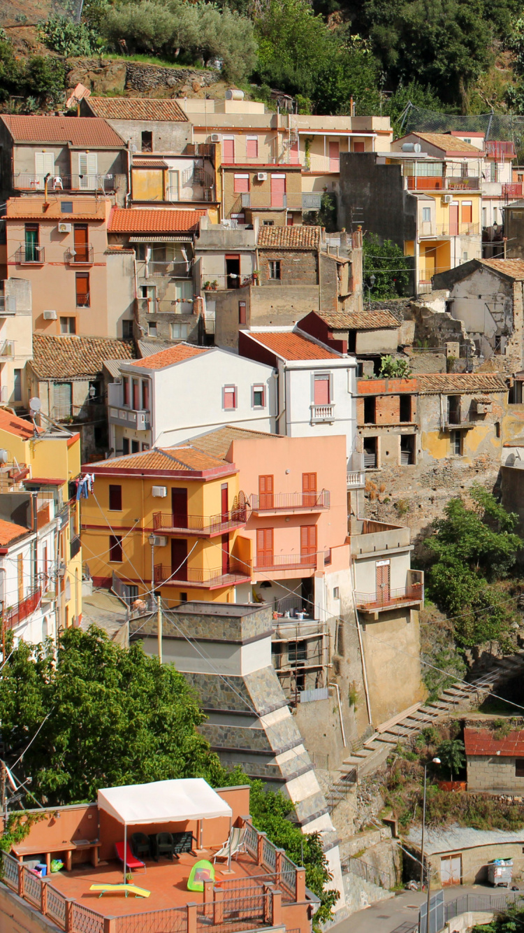White and Brown Concrete Houses on Mountain. Wallpaper in 750x1334 Resolution