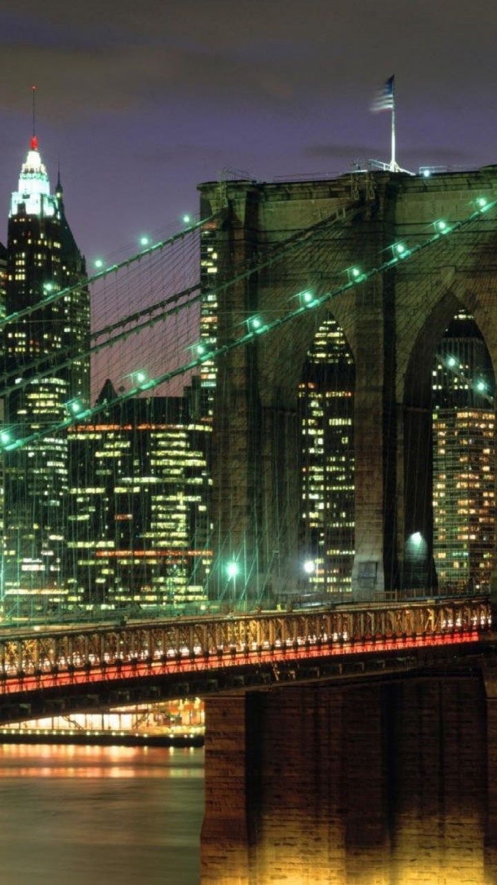 Green Bridge Over Water During Night Time. Wallpaper in 720x1280 Resolution