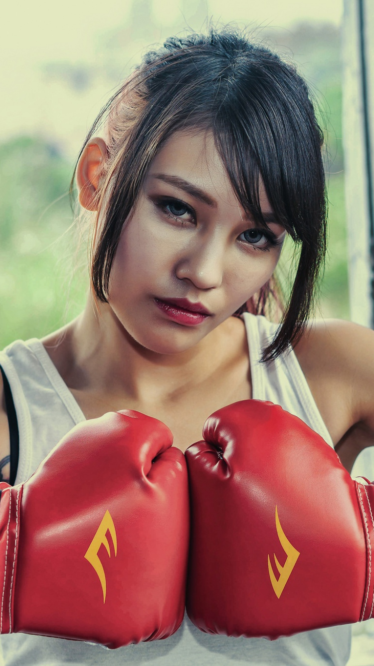 Woman in Red Boxing Gloves. Wallpaper in 750x1334 Resolution