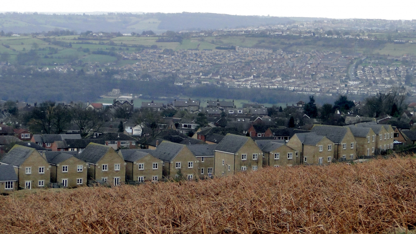 Brown and White Houses on Brown Grass Field During Daytime. Wallpaper in 1366x768 Resolution