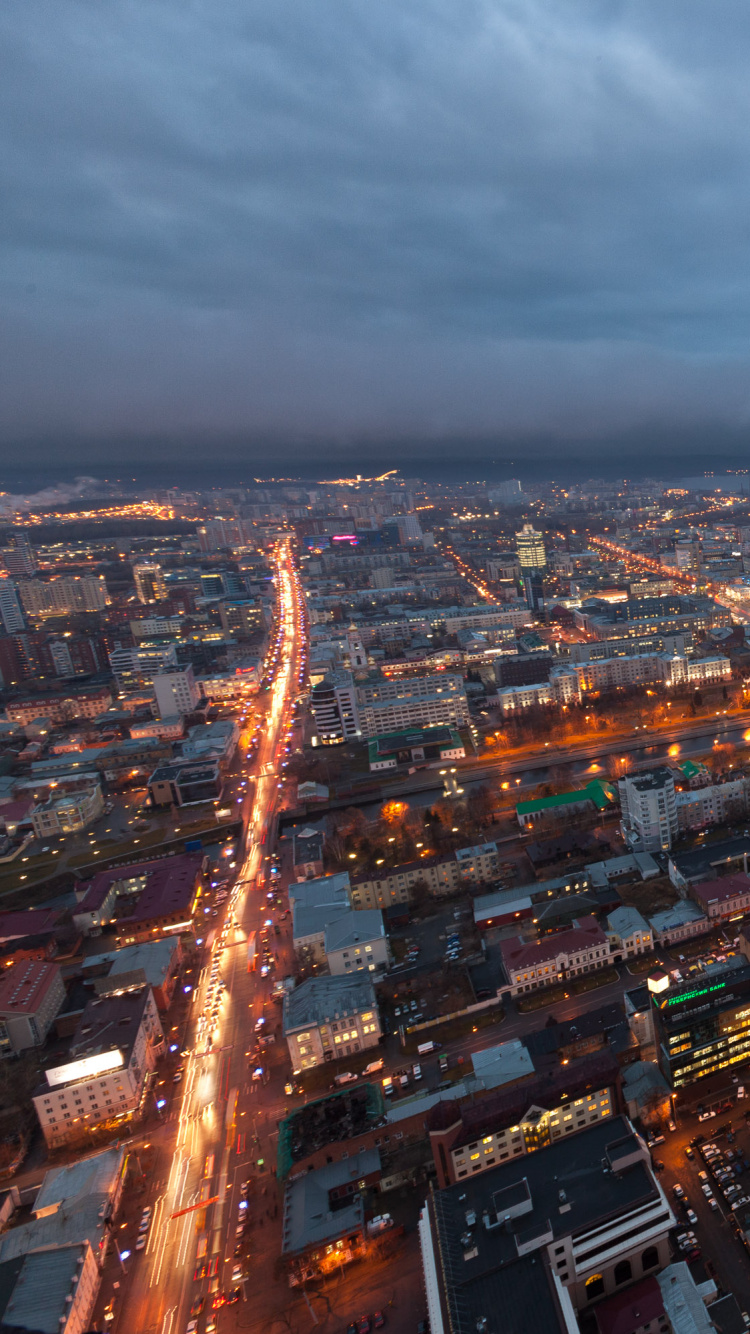 Aerial View of City Buildings During Night Time. Wallpaper in 750x1334 Resolution