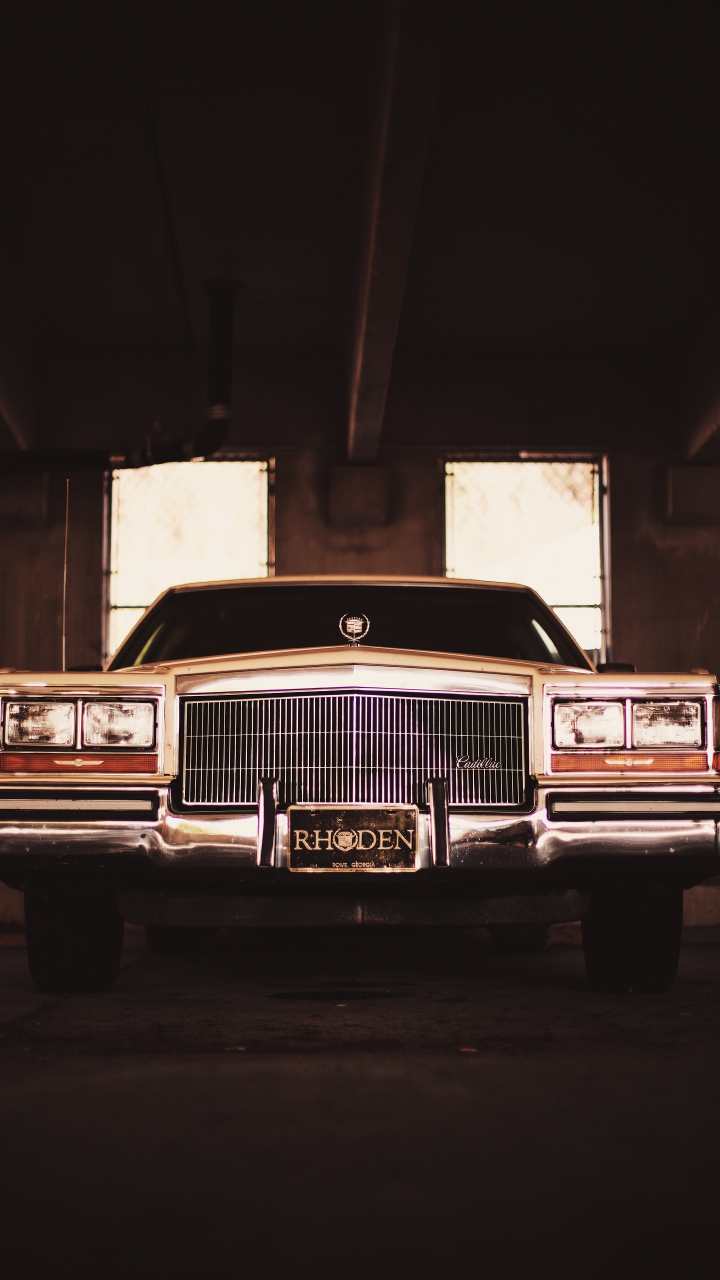 Classic Brown Car in a Garage. Wallpaper in 1440x2560 Resolution