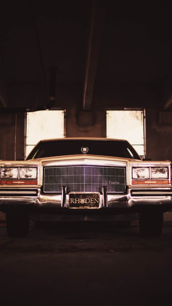Classic Brown Car in a Garage. Wallpaper in 720x1280 Resolution