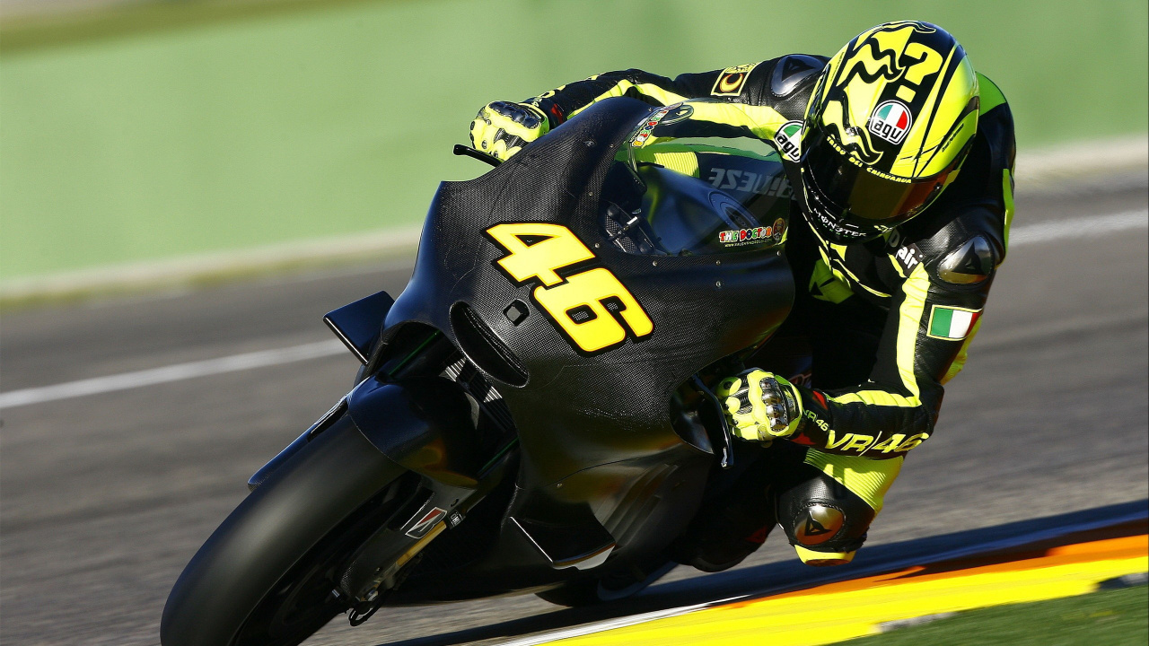Man in Black and Yellow Helmet Riding on Black and Yellow Sports Bike. Wallpaper in 1280x720 Resolution