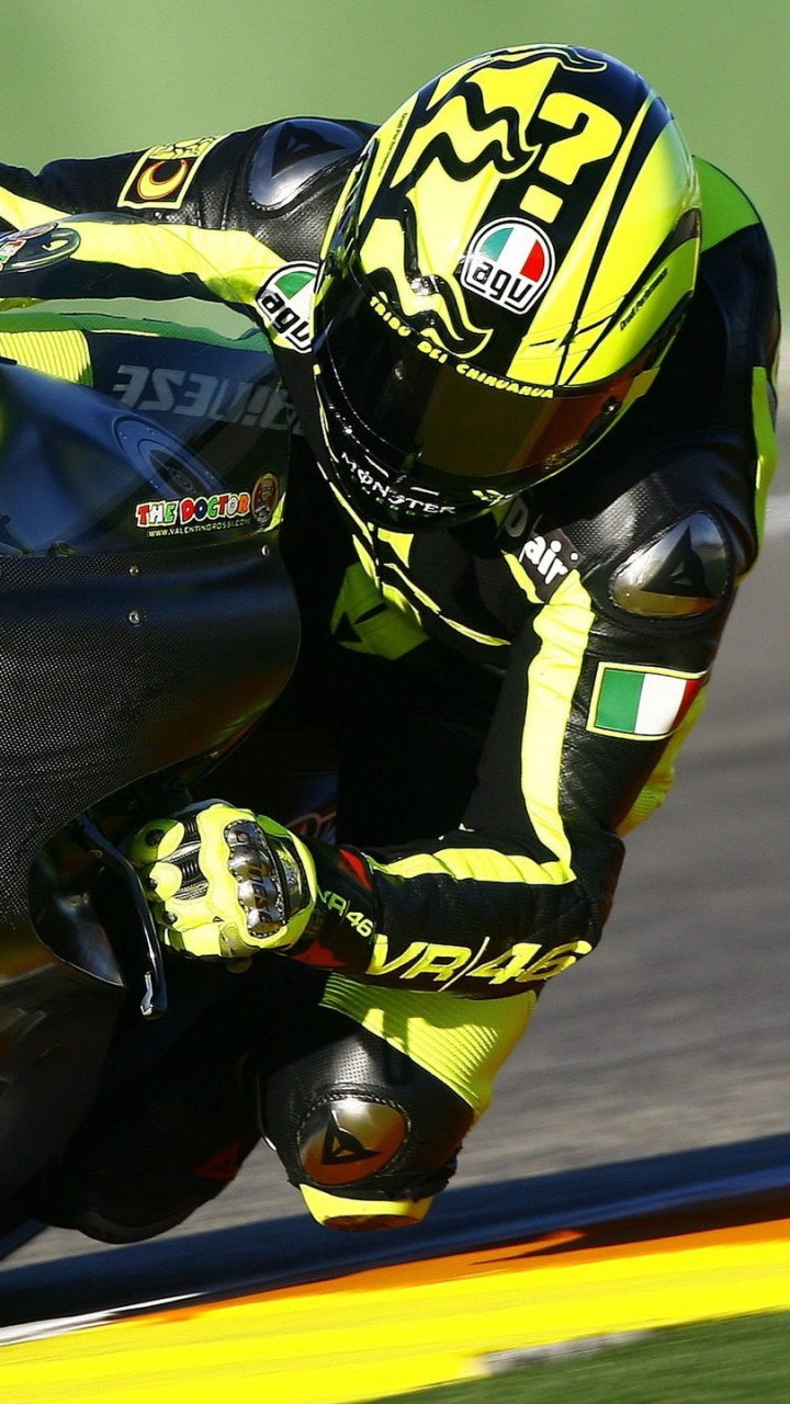 Man in Black and Yellow Helmet Riding on Black and Yellow Sports Bike. Wallpaper in 720x1280 Resolution