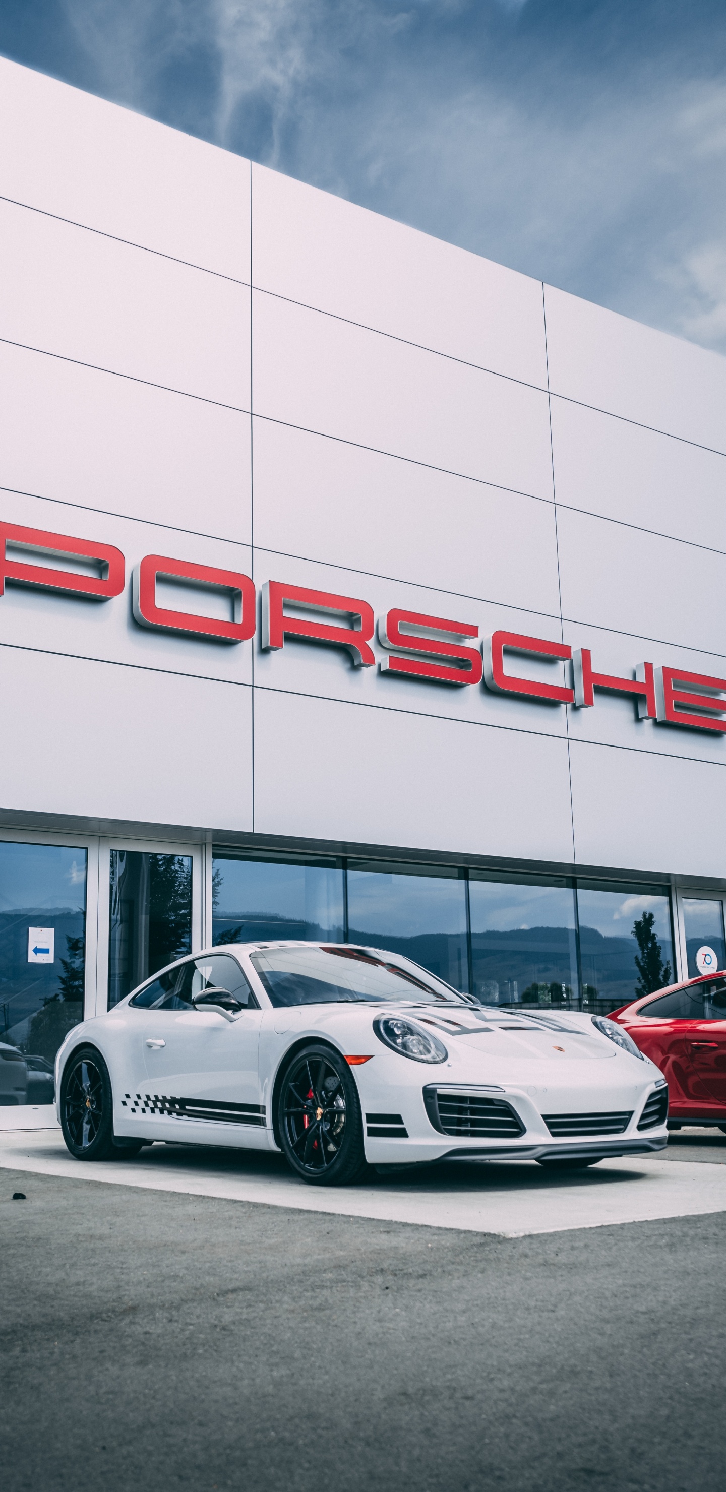 White Porsche 911 Parked in Front of White Building. Wallpaper in 1440x2960 Resolution