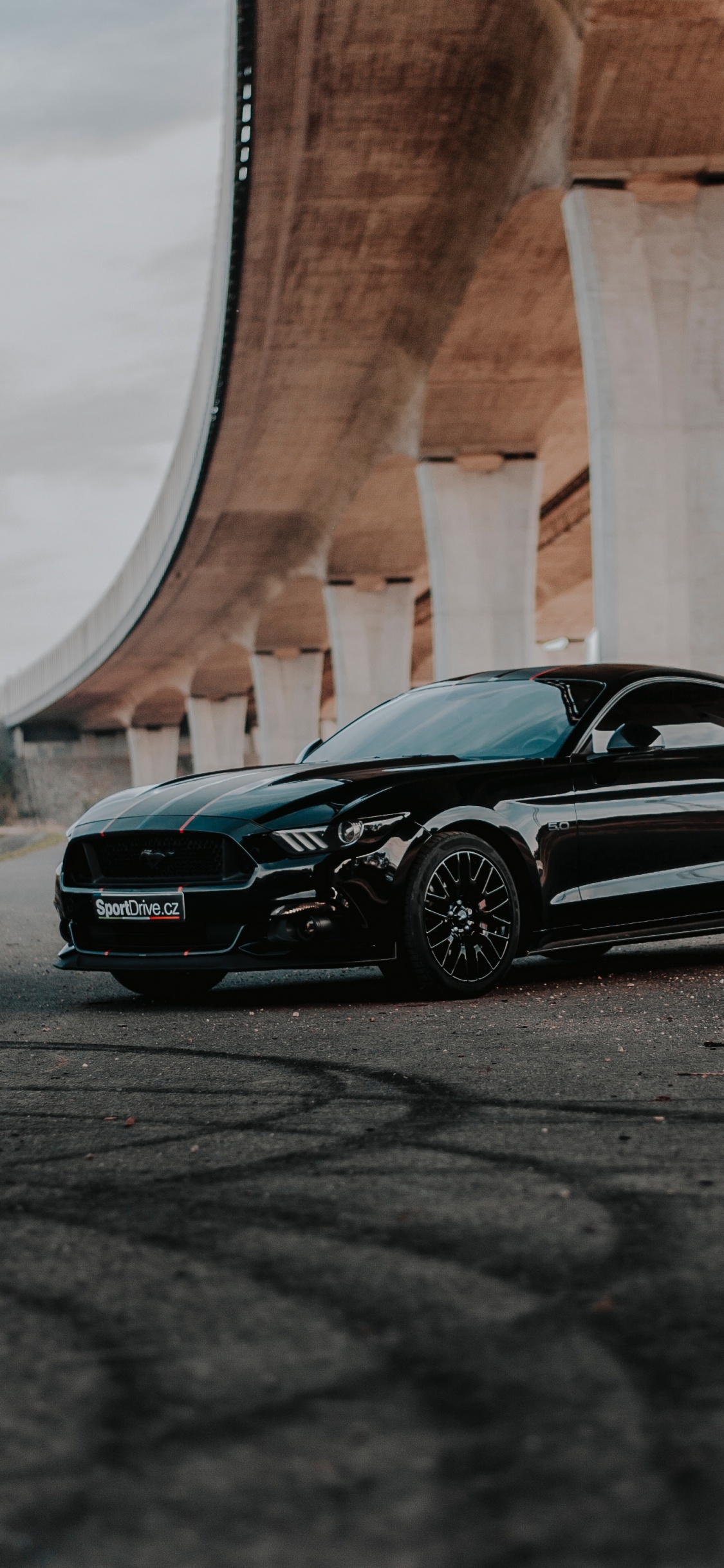 Black Mercedes Benz Coupe Parked on Gray Concrete Road During Daytime. Wallpaper in 1125x2436 Resolution