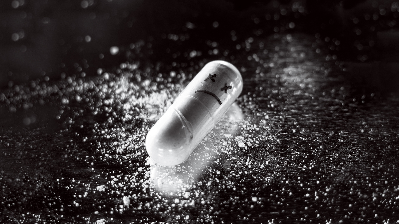 White Medication Pill on Red Surface. Wallpaper in 1366x768 Resolution