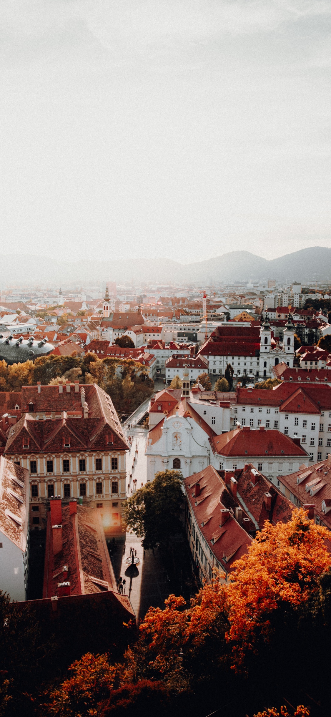 Brown and White Concrete Houses During Daytime. Wallpaper in 1125x2436 Resolution