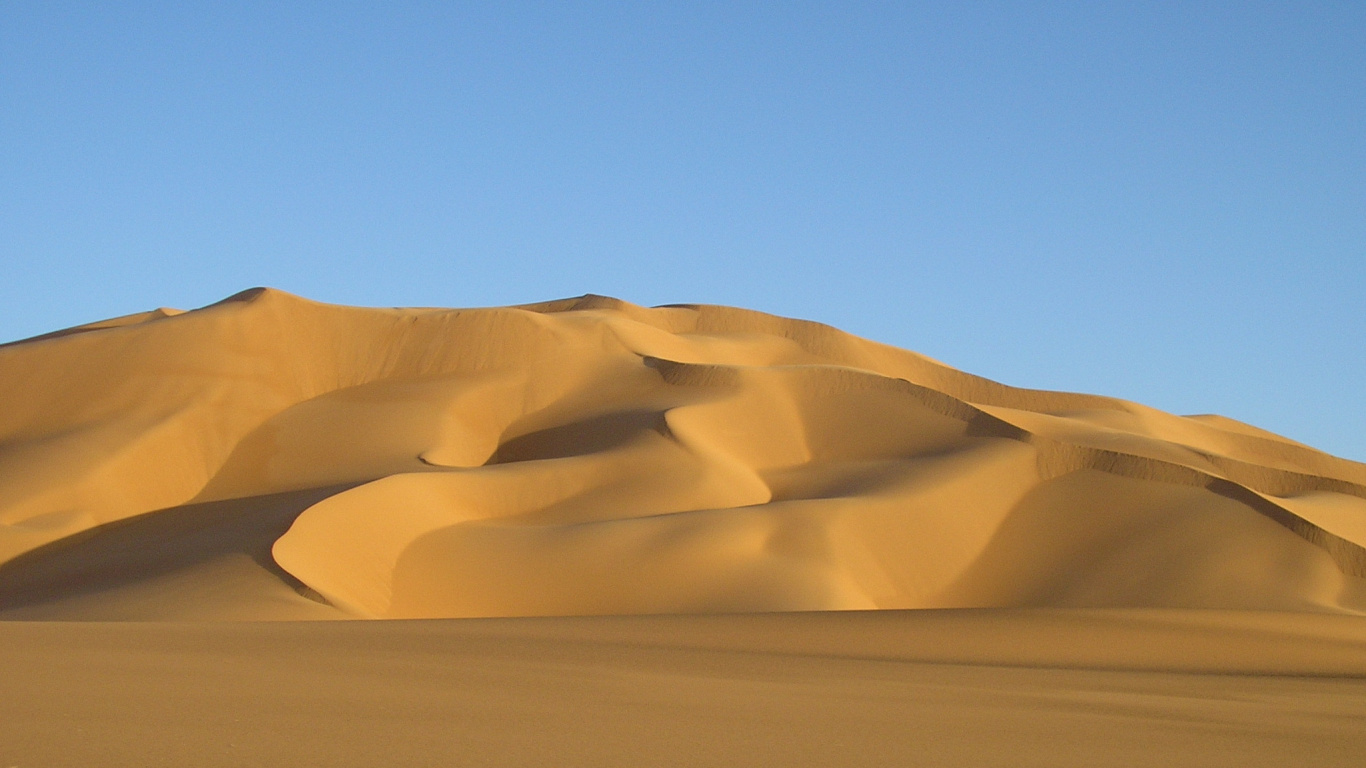 Brown Sand Dunes Under Blue Sky During Daytime. Wallpaper in 1366x768 Resolution