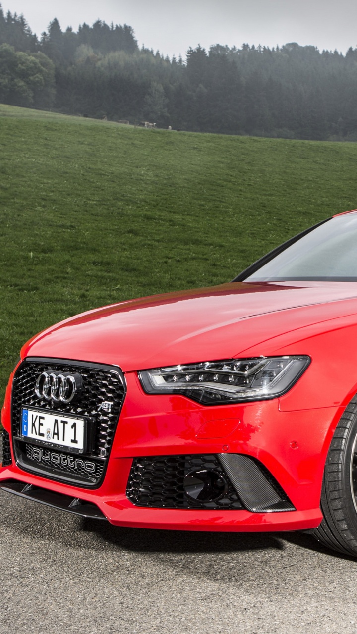 Red Audi Coupe on Green Grass Field During Daytime. Wallpaper in 720x1280 Resolution