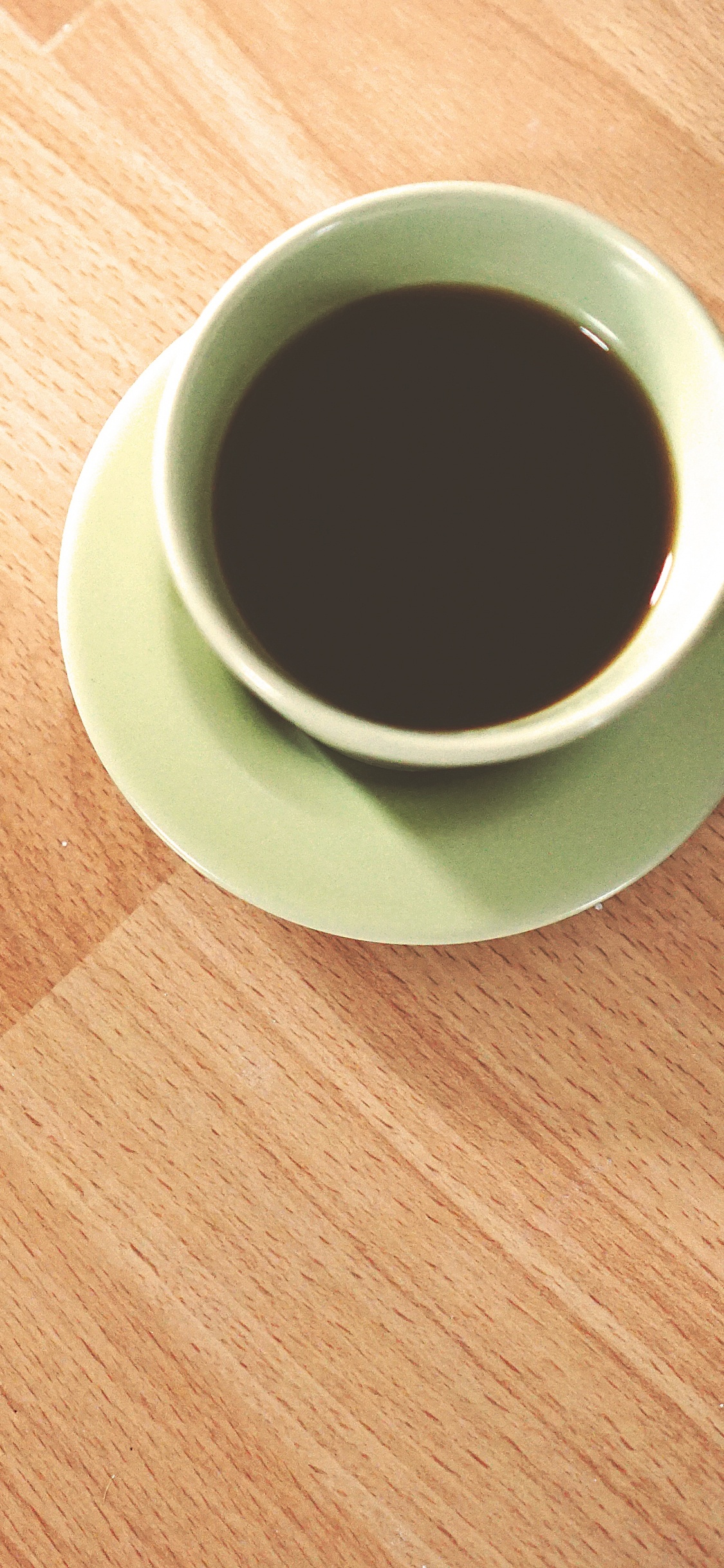 White Ceramic Mug on Brown Wooden Table. Wallpaper in 1125x2436 Resolution