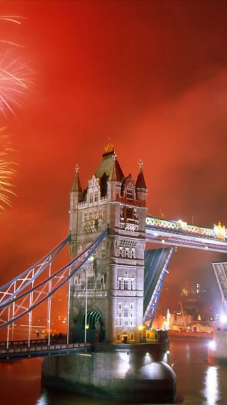Fireworks Over Bridge During Night Time. Wallpaper in 750x1334 Resolution