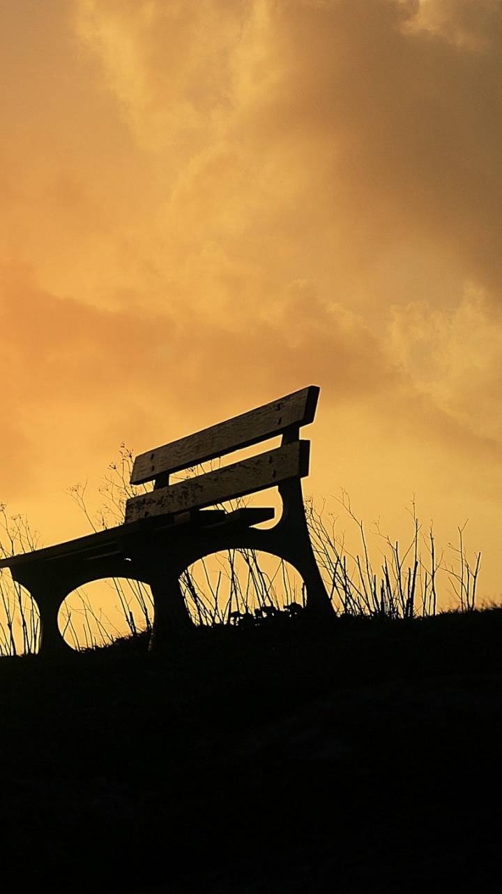 Brown Wooden Bench on Green Grass Field During Sunset. Wallpaper in 720x1280 Resolution