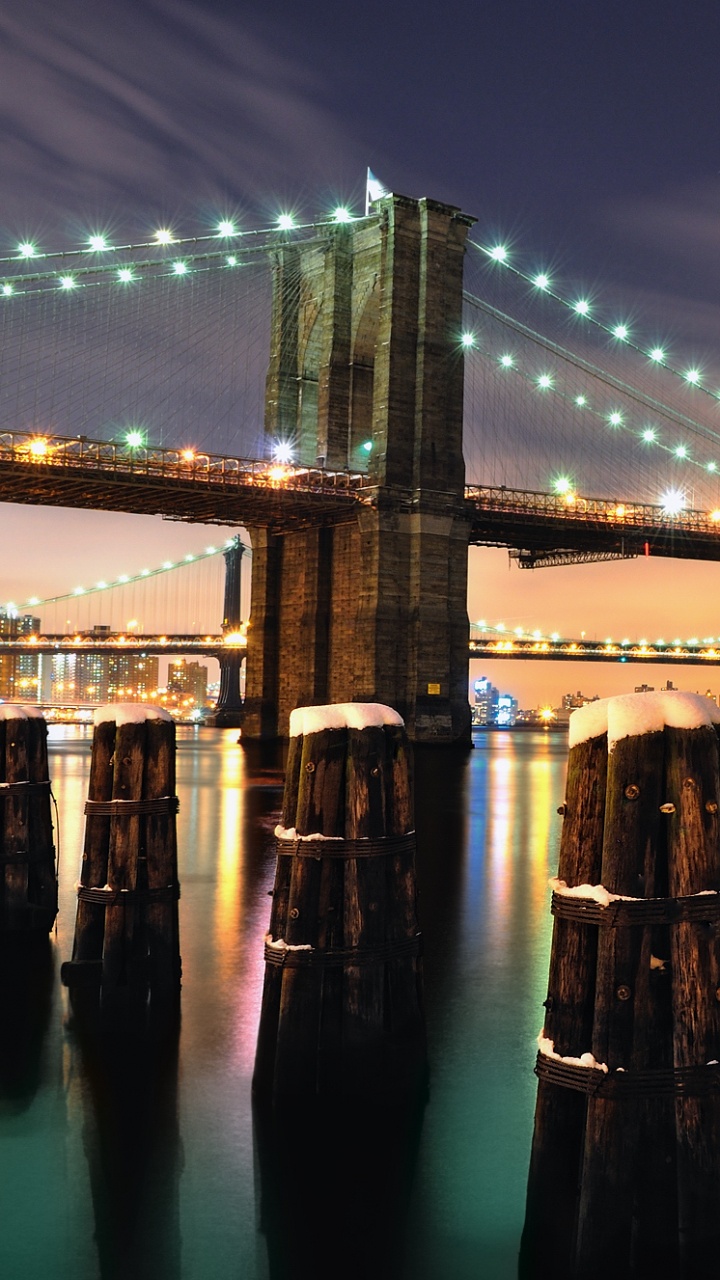 Bridge Over Water During Night Time. Wallpaper in 720x1280 Resolution