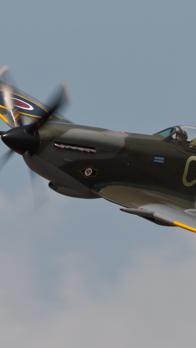 Black and Yellow Jet Plane in Mid Air. Wallpaper in 750x1334 Resolution