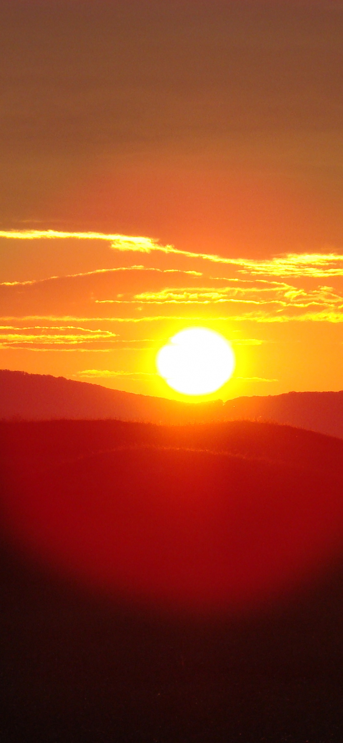 Silhouette of Mountains During Sunset. Wallpaper in 1125x2436 Resolution