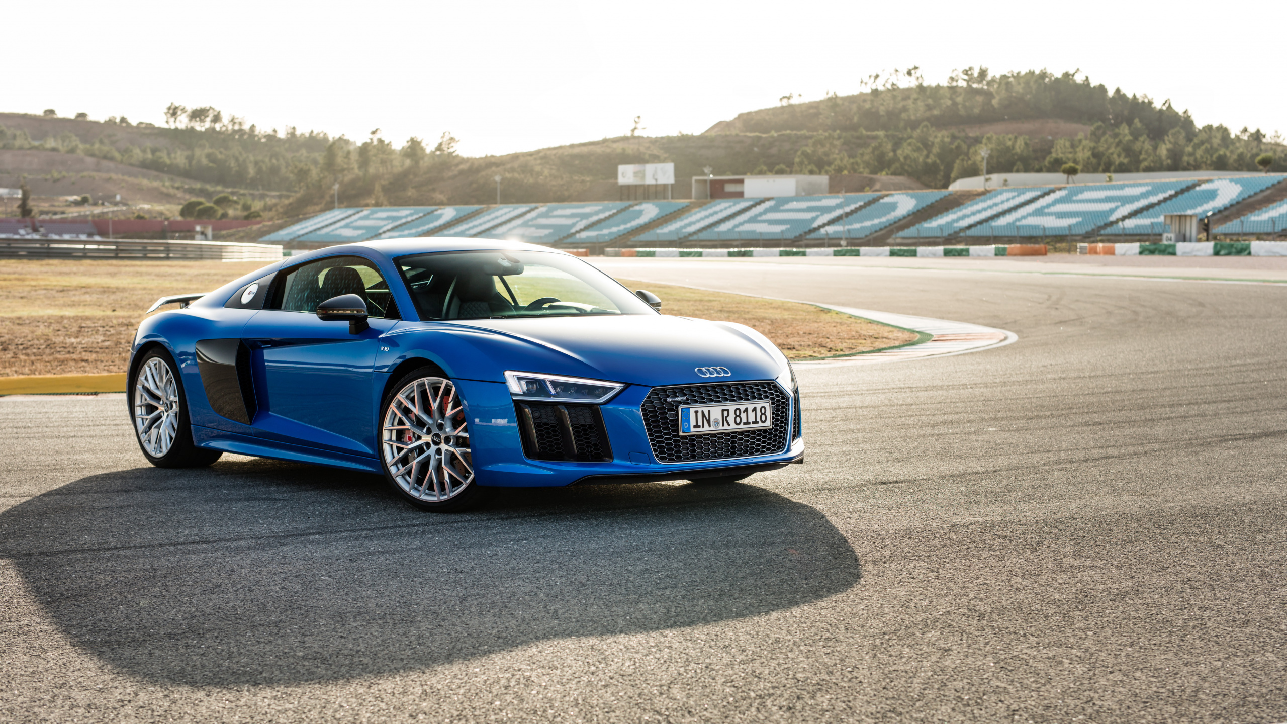 Blue Audi Coupe on Gray Asphalt Road During Daytime. Wallpaper in 2560x1440 Resolution