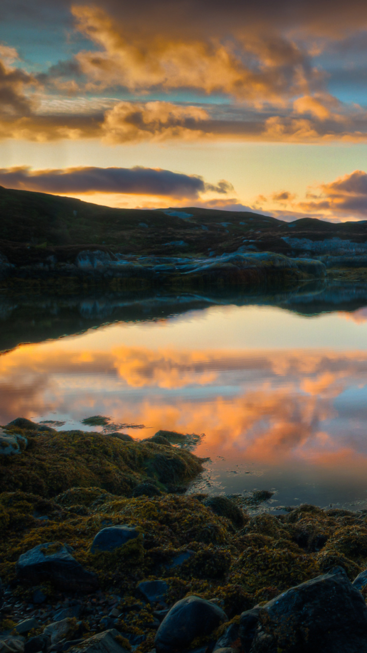 Body of Water Near Mountain During Sunset. Wallpaper in 750x1334 Resolution