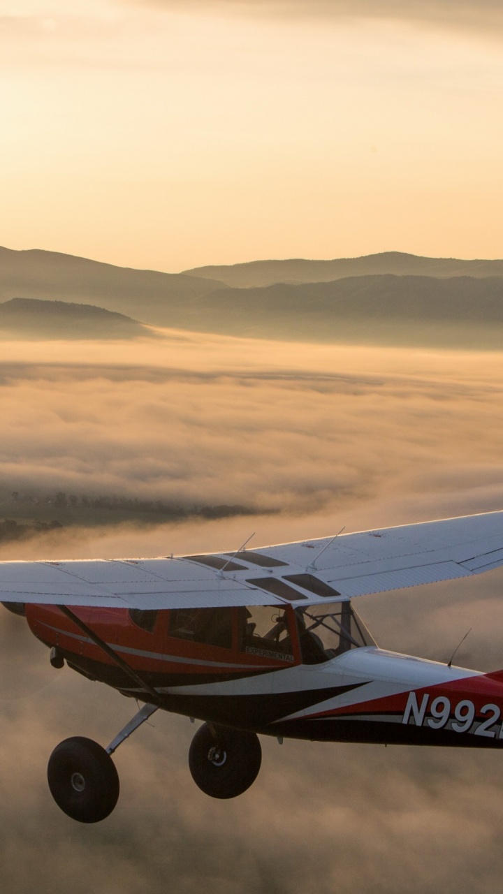 White and Red Airplane on Mid Air During Daytime. Wallpaper in 720x1280 Resolution