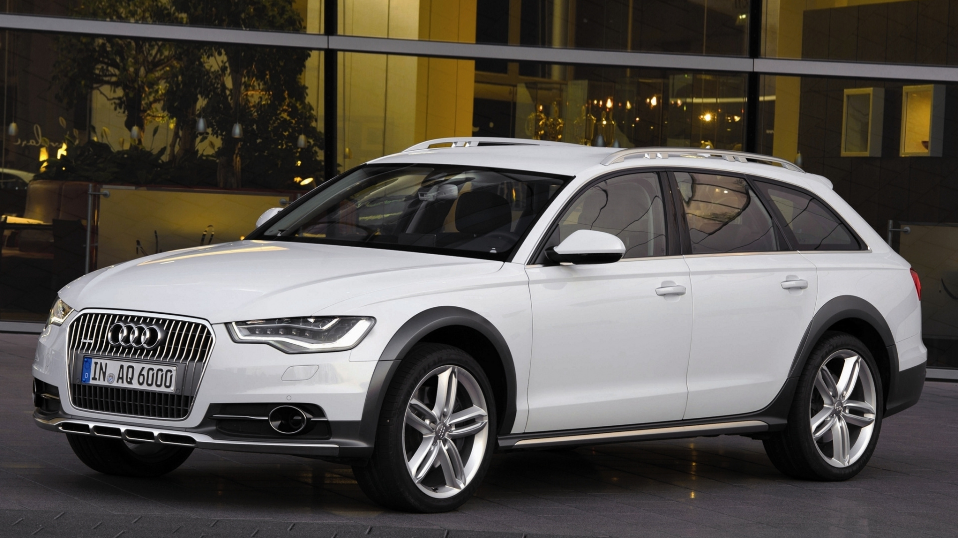 White Audi a 4 Sedan Parked Near Glass Window. Wallpaper in 1920x1080 Resolution