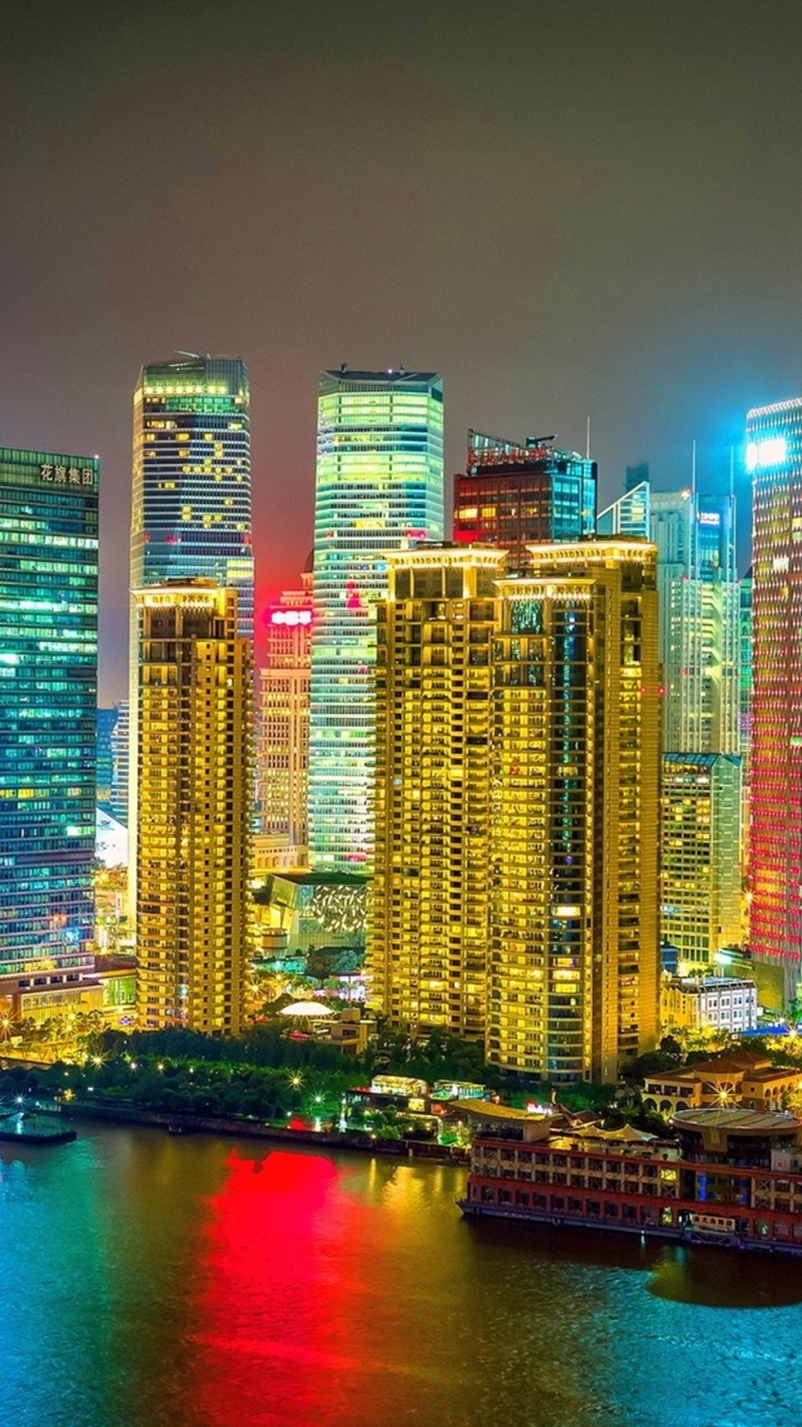 City Skyline During Night Time. Wallpaper in 720x1280 Resolution