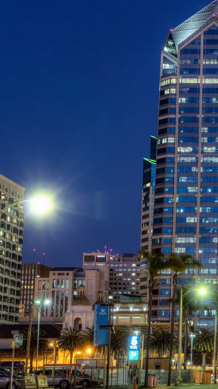 City Buildings With Lights Turned on During Night Time. Wallpaper in 750x1334 Resolution