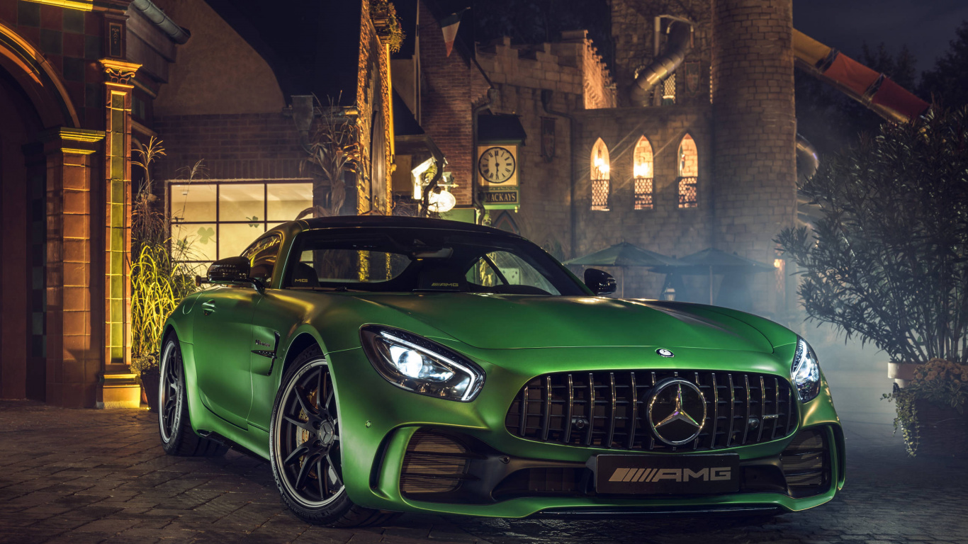 Green Car Parked Beside Brown Brick Building. Wallpaper in 1366x768 Resolution