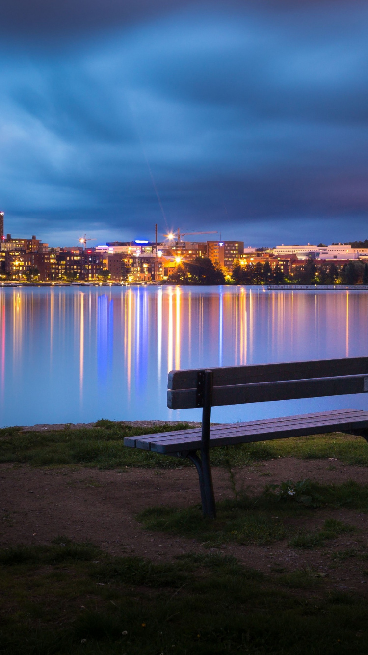 City Skyline Across Body of Water During Night Time. Wallpaper in 750x1334 Resolution