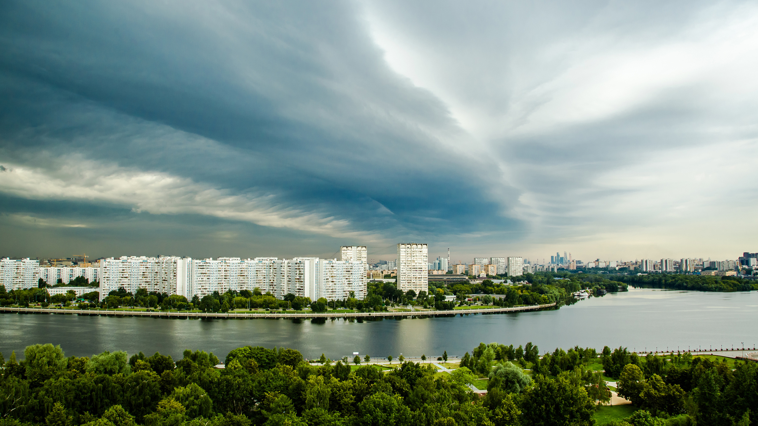 City Skyline Under Cloudy Sky During Daytime. Wallpaper in 2560x1440 Resolution