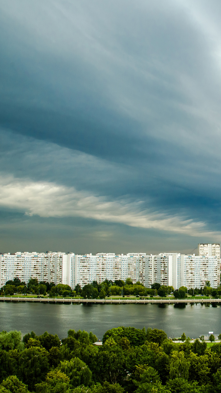 City Skyline Under Cloudy Sky During Daytime. Wallpaper in 750x1334 Resolution