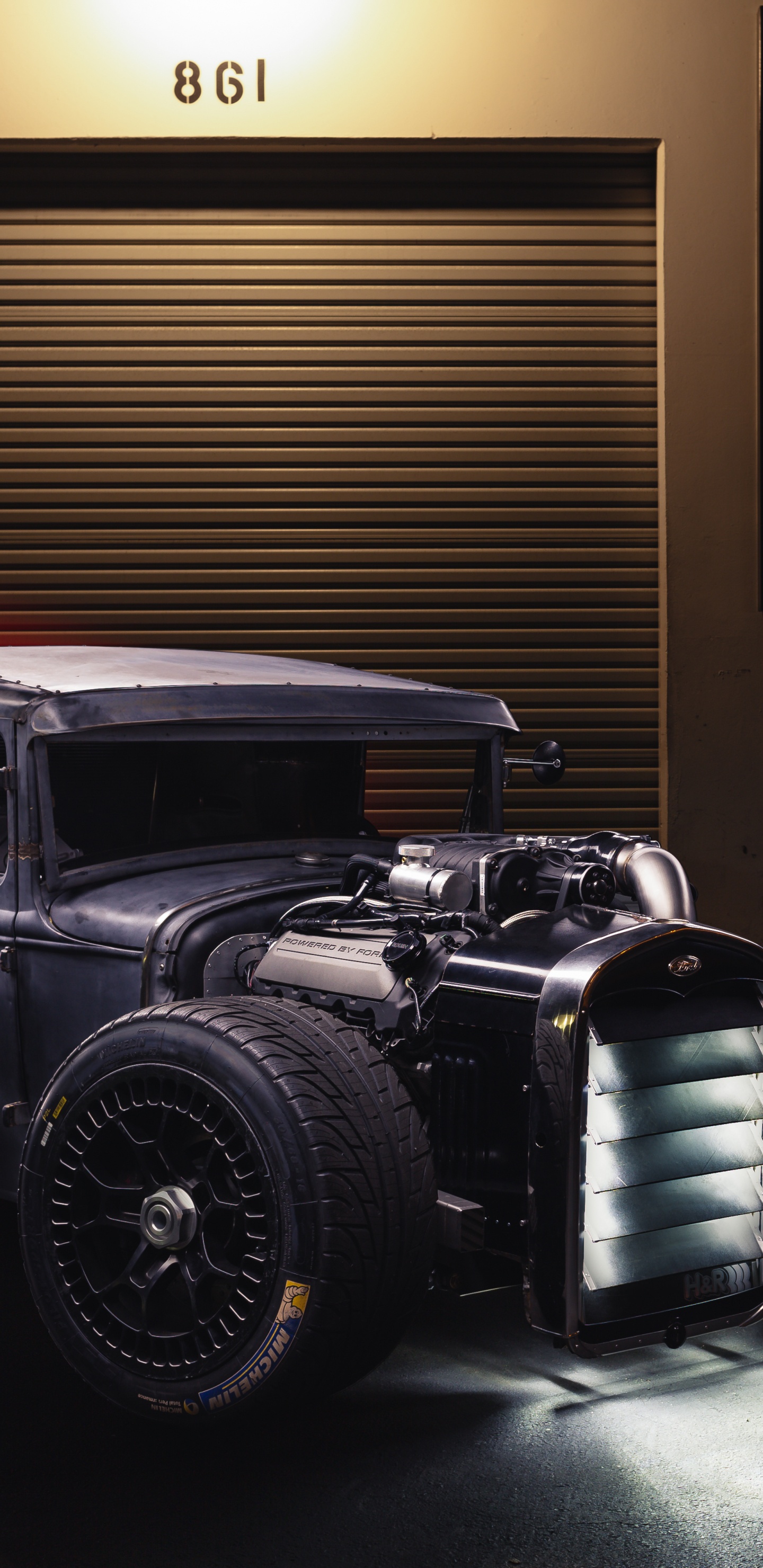 Black Vintage Car in Front of Brown Wooden Wall. Wallpaper in 1440x2960 Resolution