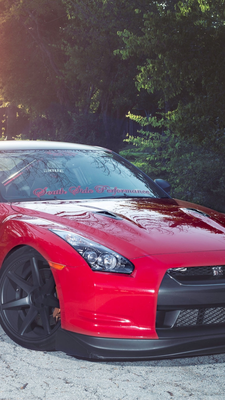 Red Ferrari 458 Italia on Road During Daytime. Wallpaper in 750x1334 Resolution