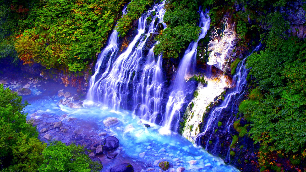 Water Falls in The Middle of Green Trees. Wallpaper in 1280x720 Resolution